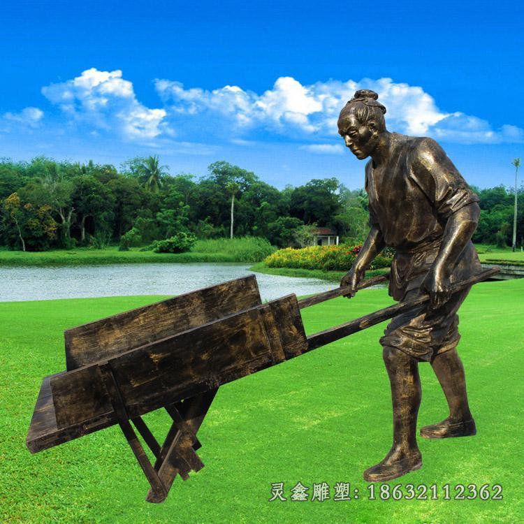 推车的人物铜雕